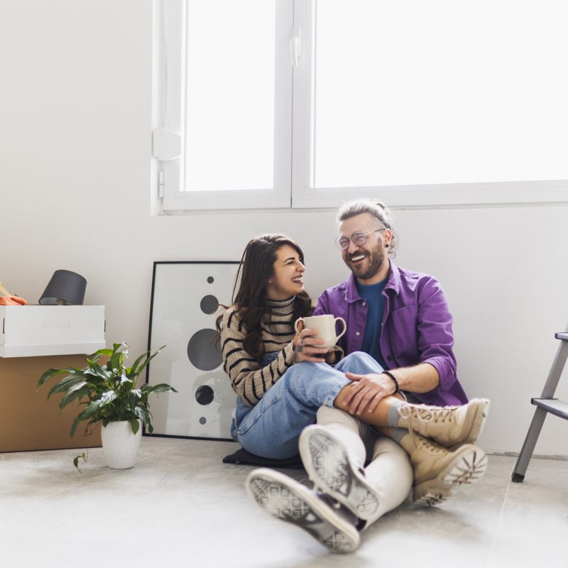 Couple drinking first coffee at their new home