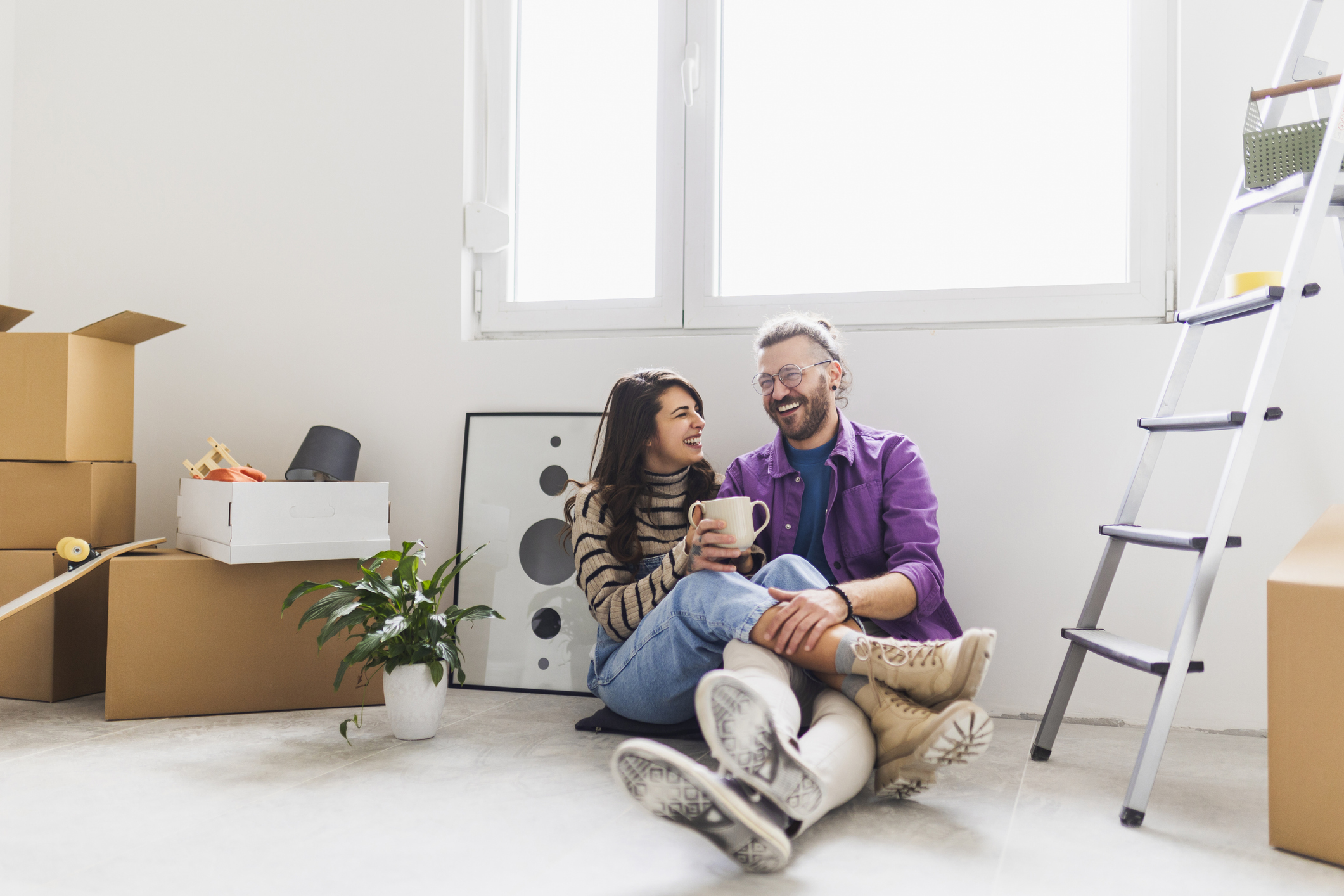 Couple drinking first coffee at their new home